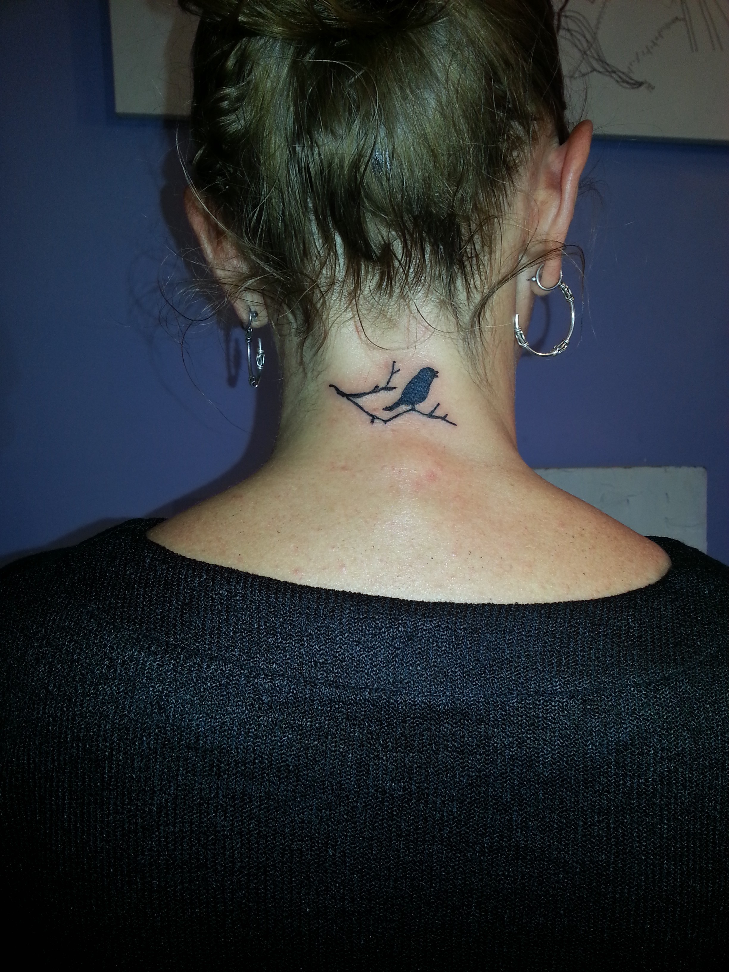 Small Bird Tattoo On Neck