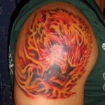 psychedelic fractal orange fire cat shoulder tattoo by Adal