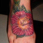 color hibiscus flower foot tattoo by Adal