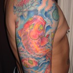 full color ocean koi fish with water lilies arm sleeve by Majestic Tattoo