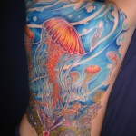 fractal psychedelic blue and orange jellyfish ocean full color back tattoo by Adal