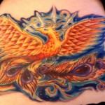 Colorful psychedelic phoenix cover up tattoo