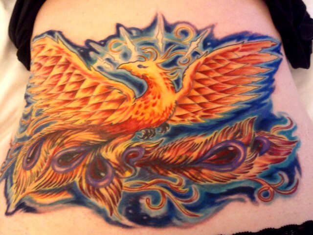Colorful psychedelic phoenix cover up tattoo