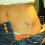 angel wing detailed hip small tattoo
