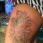 feminine butterfly thigh tattoo