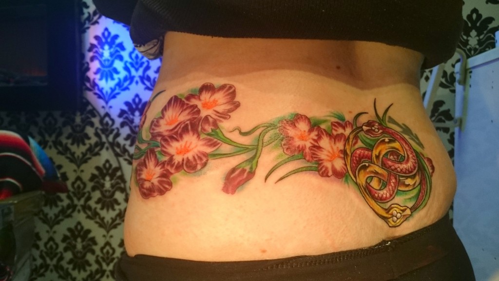 17 Lower Back Tattoos That Are Meaningful
